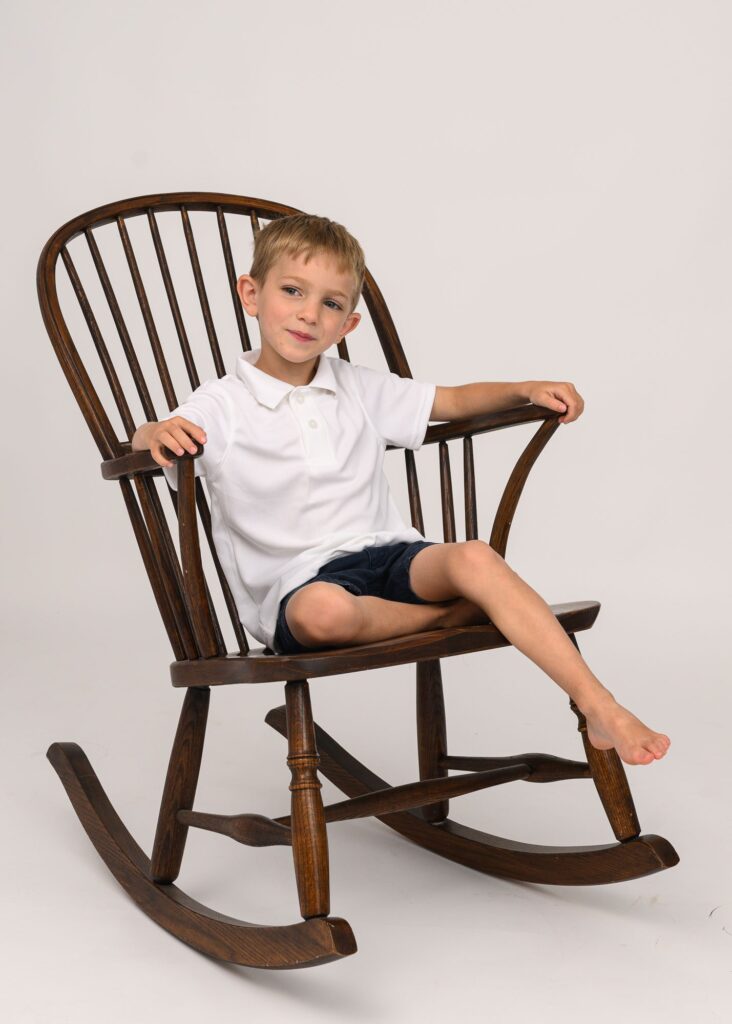 little boy in rocking chair